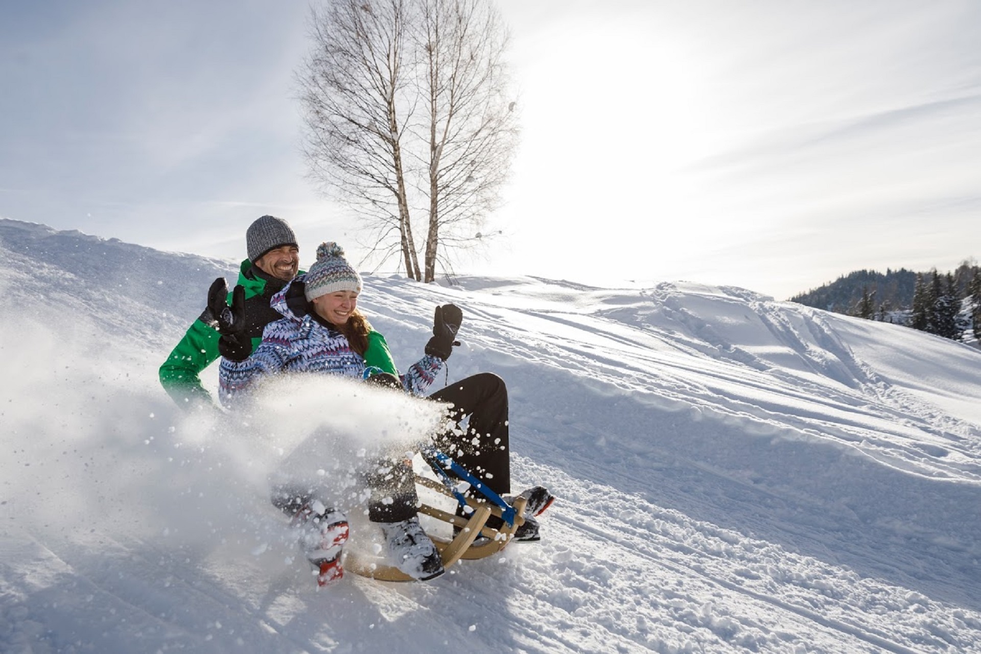 Hotel Gasthof Weissensee Kärnten Rodelerlebnis auf 4 km Naturrodelbahn